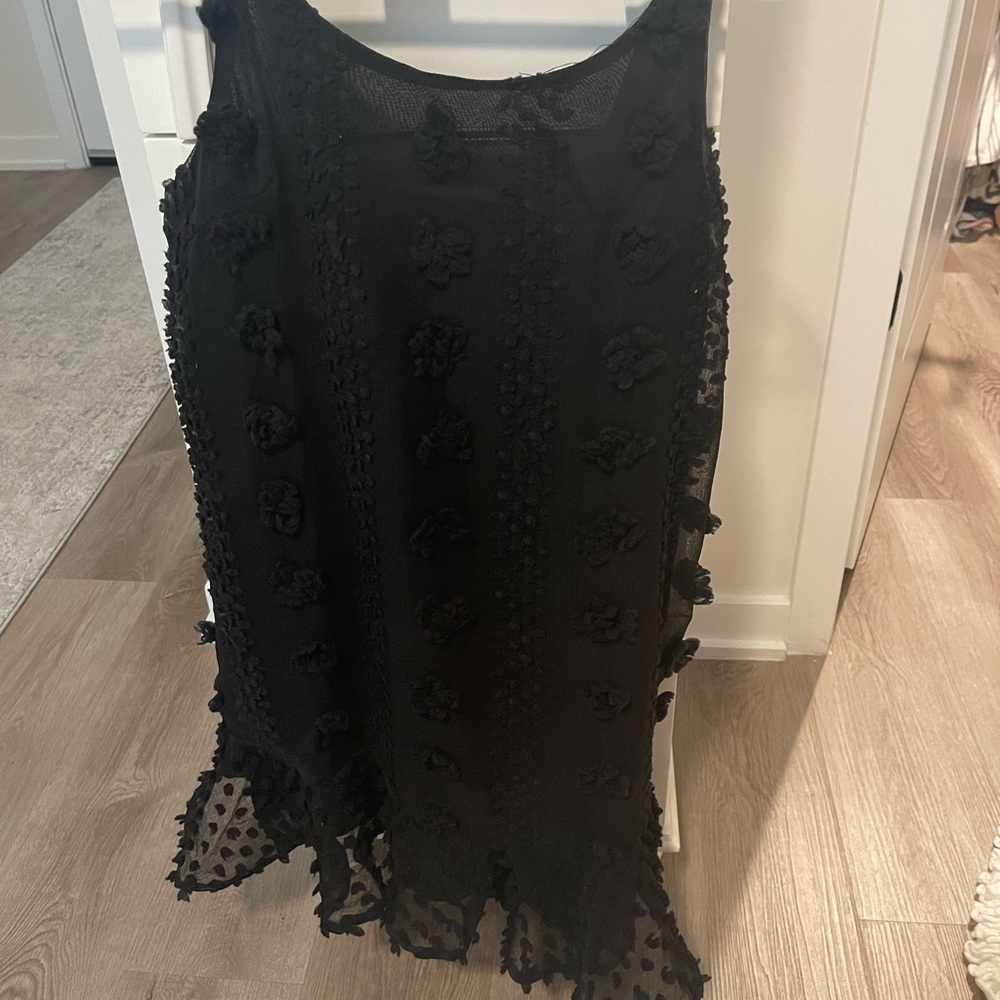 black dress with bottom ruffle